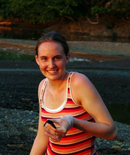 Kelsey Carnahan holding a baby sea turtle