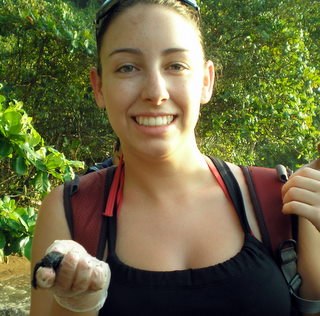 Sarah Cross holding a baby sea turtle