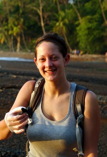 Brittany Cramer holding a baby sea turtle