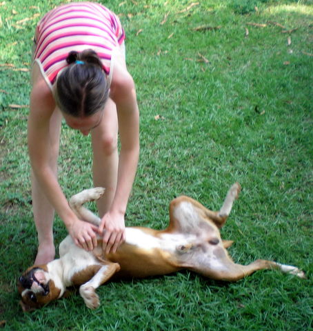 Kelsey petting a dog